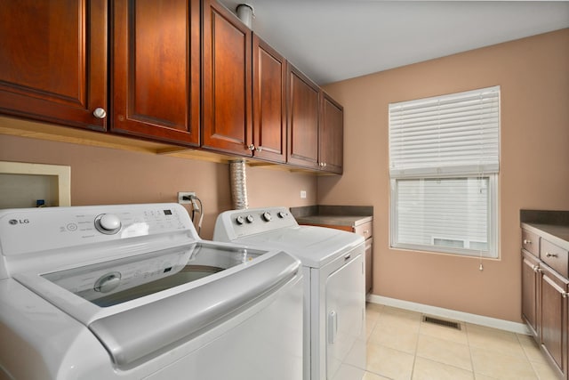 8013 Shady Oak Rd, Joliet, IL 60431 - washroom with cabinet space, washing machine and dryer, baseboards, and light tile patterned flooring