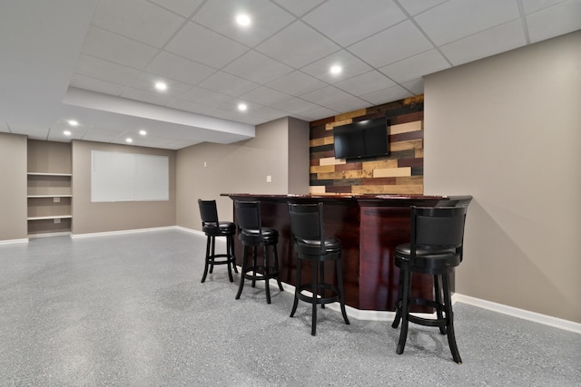 8013 Shady Oak Rd, Joliet, IL 60431 - indoor bar featuring baseboards, recessed lighting, speckled floor, and built in shelves