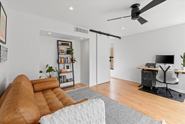 2943 N Lincoln Ave Unit 202, Chicago, IL 60657 - office area featuring a barn door, wood finished floors, ceiling fan, and recessed lighting