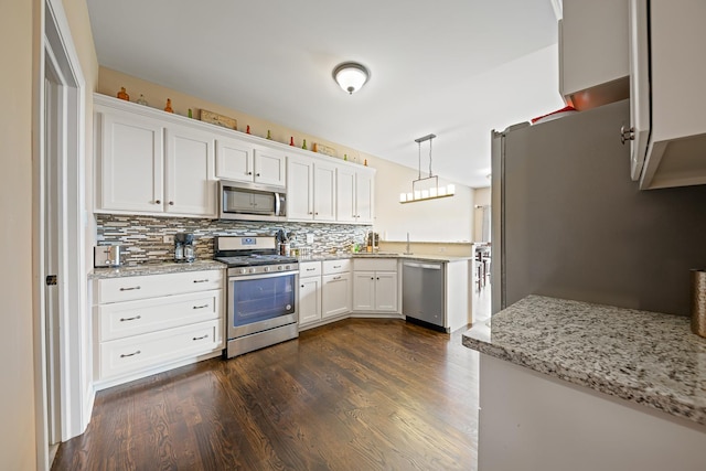 10749 Revere Cir, Mokena, IL 60448 - kitchen featuring stainless steel appliances, decorative backsplash, dark wood-type flooring, and white cabinets