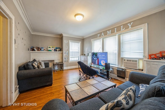 22 S Austin Blvd, Oak Park, IL 60302 - living area featuring wood finished floors, crown molding, cooling unit, and a brick fireplace