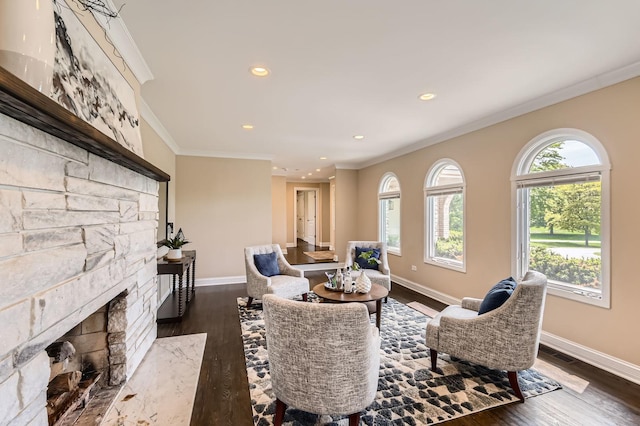406 Lauder Ln, Inverness, IL 60067 - living room featuring crown molding, baseboards, a stone fireplace, dark wood-style flooring, and recessed lighting
