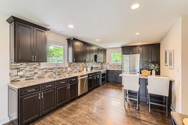 406 Lauder Ln, Inverness, IL 60067 - kitchen featuring stainless steel appliances, a sink, plenty of natural light, tasteful backsplash, and recessed lighting