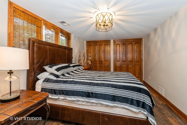13103 W Beaver Lake Dr, Homer Glen, IL 60491 - bedroom featuring wood finished floors, multiple closets, and a chandelier