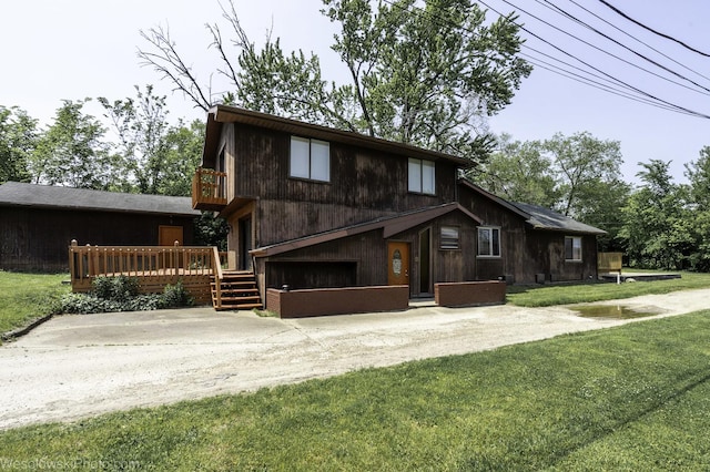 23314 W Liberty Ave, Lake Villa, IL 60046 - view of front of property featuring a garage, a front lawn, a wooden deck, and concrete driveway