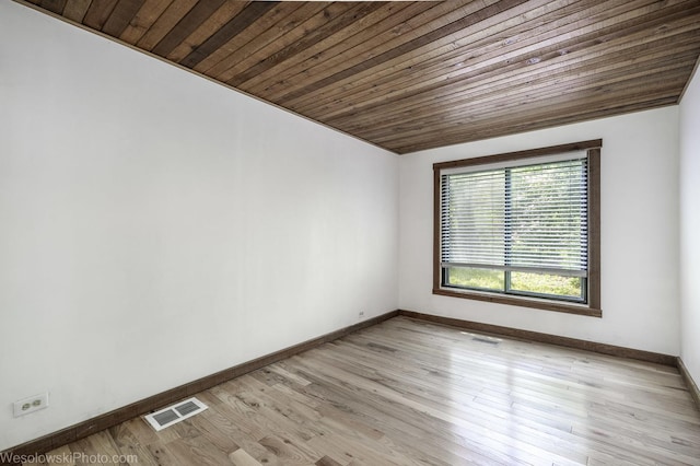 23314 W Liberty Ave, Lake Villa, IL 60046 - unfurnished room with baseboards, wooden ceiling, and light wood-style floors