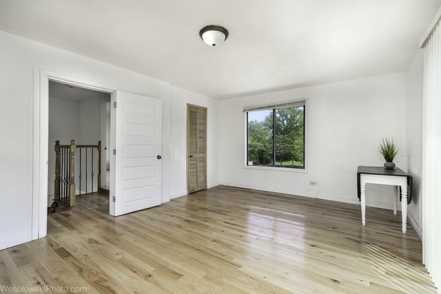 23314 W Liberty Ave, Lake Villa, IL 60046 - unfurnished bedroom with light wood-style floors and baseboards