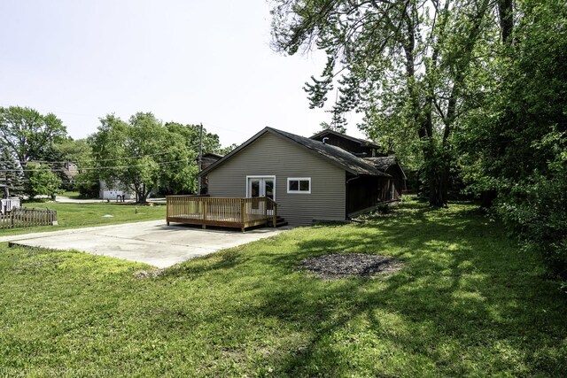 23314 W Liberty Ave, Lake Villa, IL 60046 - back of property with a deck, a patio, and a lawn