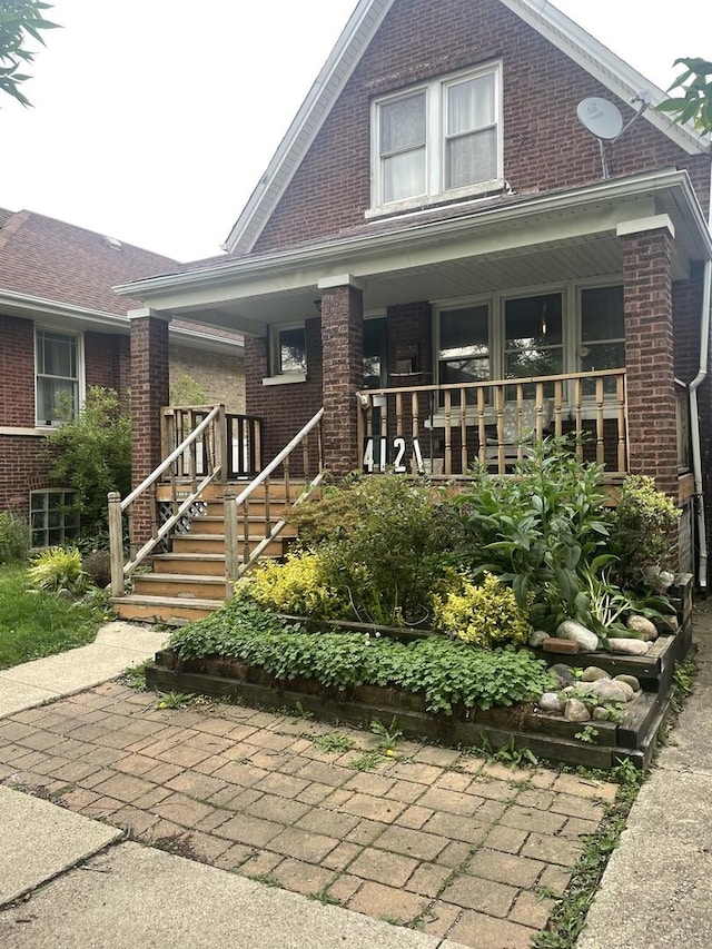 4121 N Moody Ave, Chicago, IL 60634 - view of front of home featuring brick siding and a porch