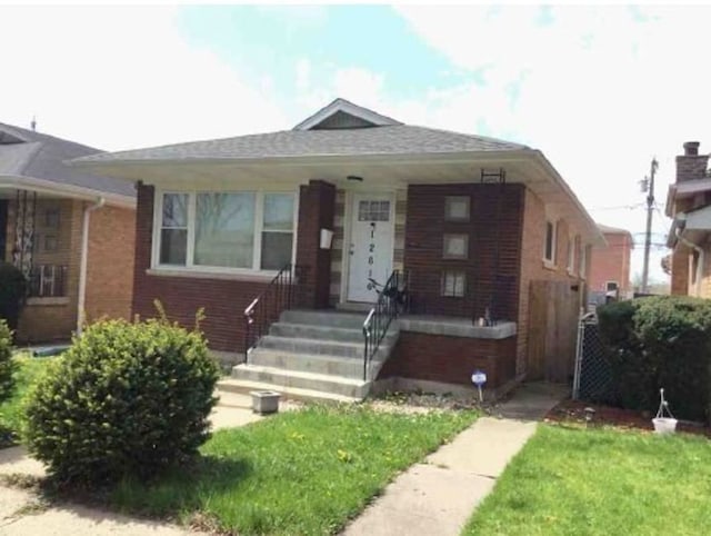 12616 S Lincoln St, Calumet Park, IL 60827 - bungalow-style house featuring brick siding, covered porch, and a front lawn