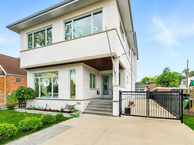7415 W Main St, Niles, IL 60714 - view of front facade with a gate and brick siding