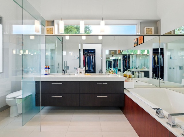 7415 W Main St, Niles, IL 60714 - full bathroom featuring vanity, a walk in closet, and tile patterned flooring