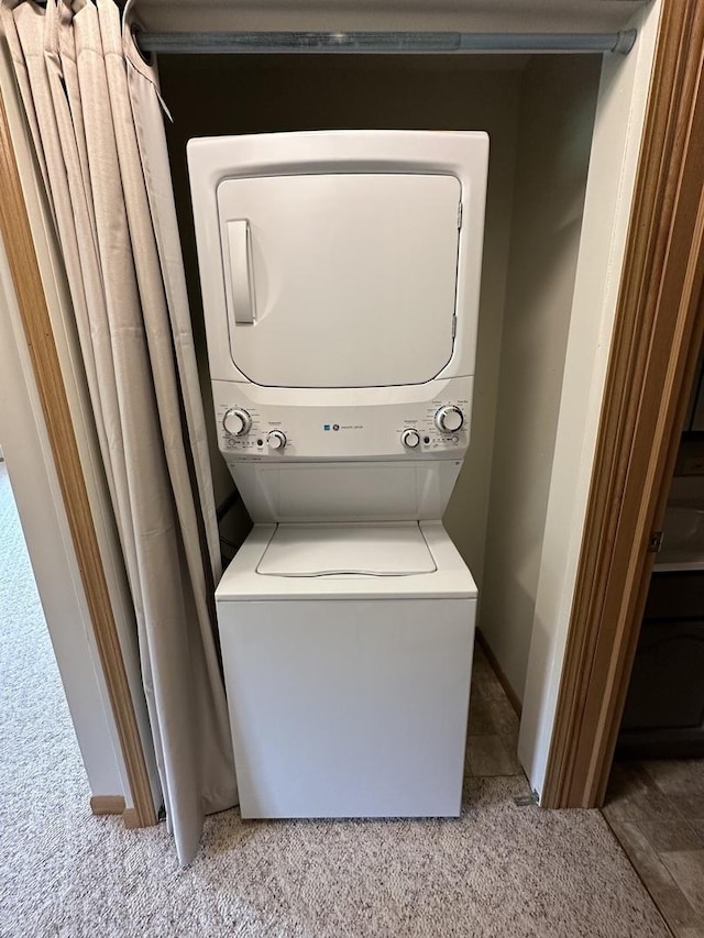 2406A Coventry Ct Unit 2406, Sterling, IL 61081 - laundry room with stacked washer / dryer, carpet flooring, and baseboards