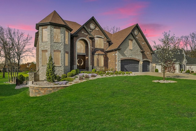 14151 131st St, Lemont, IL 60439 - french country style house featuring stone siding, concrete driveway, a yard, and an attached garage