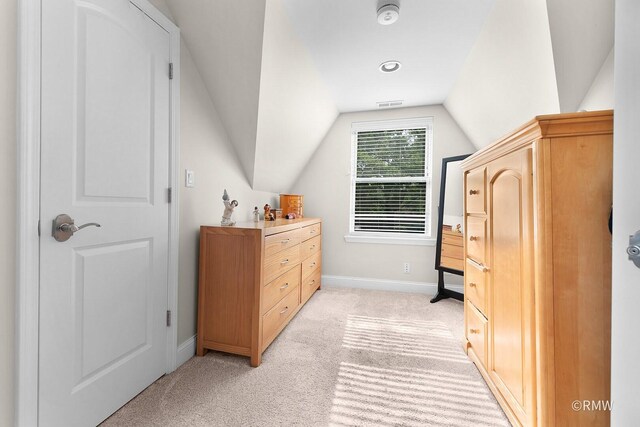 735 S Spring Rd, Elmhurst, IL 60126 - bedroom featuring lofted ceiling, baseboards, and light colored carpet