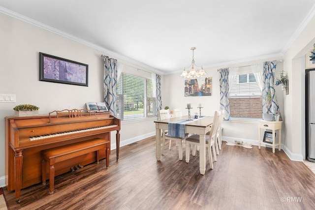 735 S Spring Rd, Elmhurst, IL 60126 - dining space with a chandelier, wood finished floors, baseboards, and crown molding