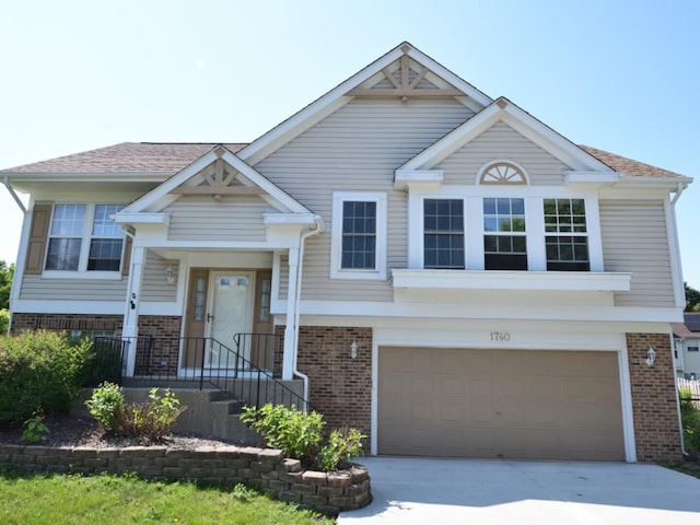1740 Somerfield Ln, Crystal Lake, IL 60014 - view of front of property with brick siding, a garage, and concrete driveway