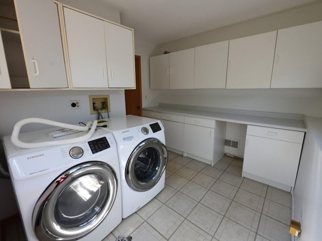 1740 Somerfield Ln, Crystal Lake, IL 60014 - laundry room with cabinet space, separate washer and dryer, and light tile patterned flooring