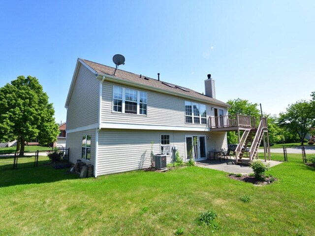1740 Somerfield Ln, Crystal Lake, IL 60014 - back of property with stairway, a deck, a chimney, a patio area, and central AC unit