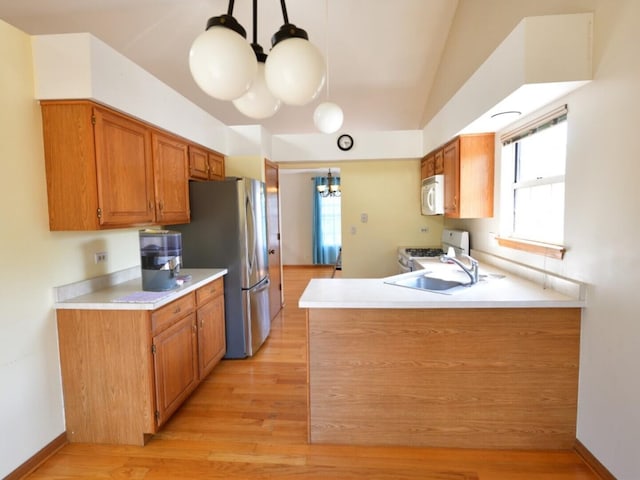 1740 Somerfield Ln, Crystal Lake, IL 60014 - kitchen featuring white appliances, a chandelier, light wood-style flooring, light countertops, and vaulted ceiling