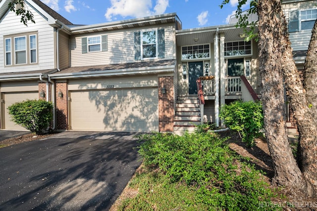 3023 Saganashkee Ln, Naperville, IL 60564 - townhome / multi-family property with brick siding, a garage, and driveway
