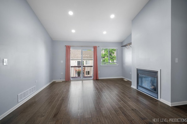 3023 Saganashkee Ln, Naperville, IL 60564 - unfurnished living room featuring dark wood-type flooring, a glass covered fireplace, baseboards, lofted ceiling, and recessed lighting