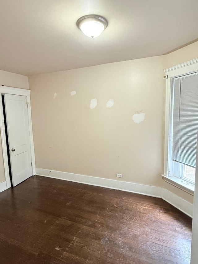 7621 S Normal Ave, Chicago, IL 60620 - spare room with dark wood finished floors and baseboards