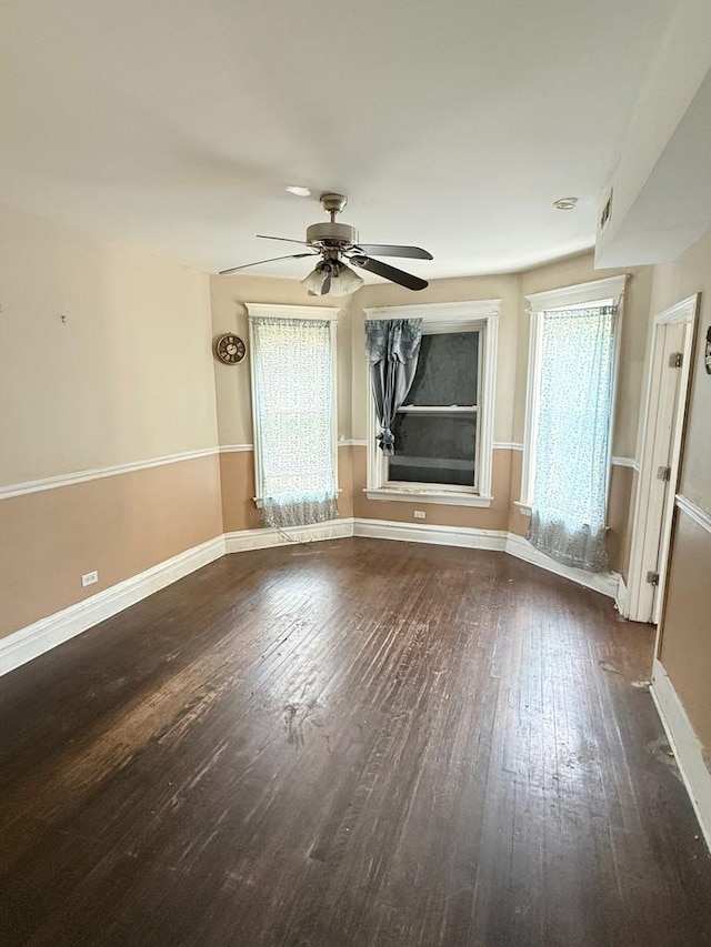 7621 S Normal Ave, Chicago, IL 60620 - unfurnished living room with wood finished floors, ceiling fan, and baseboards