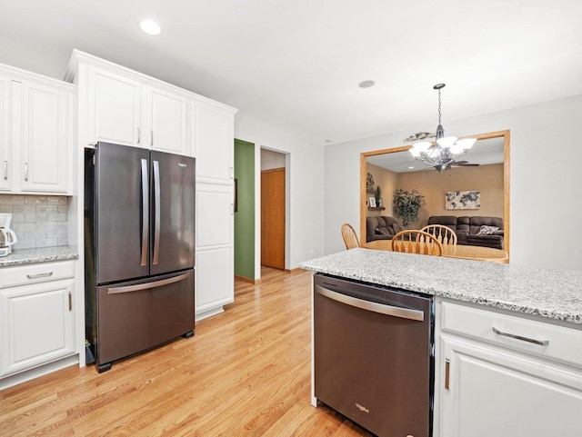 3445 W 114th St, Chicago, IL 60655 - kitchen with appliances with stainless steel finishes, a chandelier, light wood-type flooring, white cabinetry, and recessed lighting