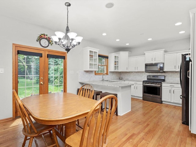 3445 W 114th St, Chicago, IL 60655 - dining area featuring french doors, light wood-style flooring, a chandelier, and recessed lighting