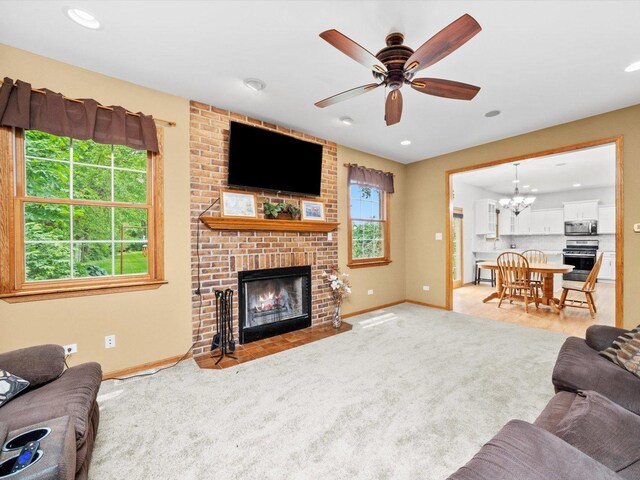 3445 W 114th St, Chicago, IL 60655 - living area with baseboards, a brick fireplace, a chandelier, a ceiling fan, and recessed lighting