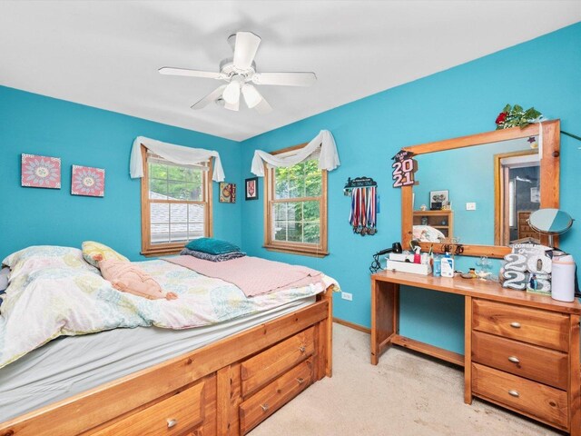 3445 W 114th St, Chicago, IL 60655 - bedroom with light carpet, ceiling fan, and baseboards