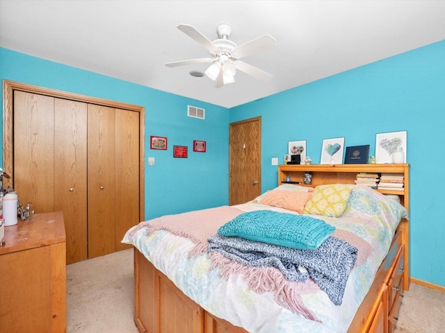 3445 W 114th St, Chicago, IL 60655 - bedroom featuring light carpet, a closet, a ceiling fan, and baseboards