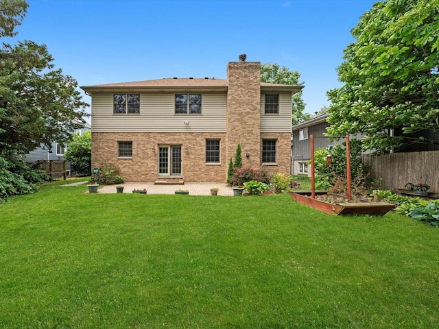 3445 W 114th St, Chicago, IL 60655 - back of property featuring a chimney, a patio, a garden, and brick siding