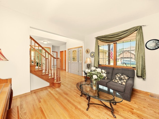 3445 W 114th St, Chicago, IL 60655 - living area featuring wood finished floors, stairway, and baseboards