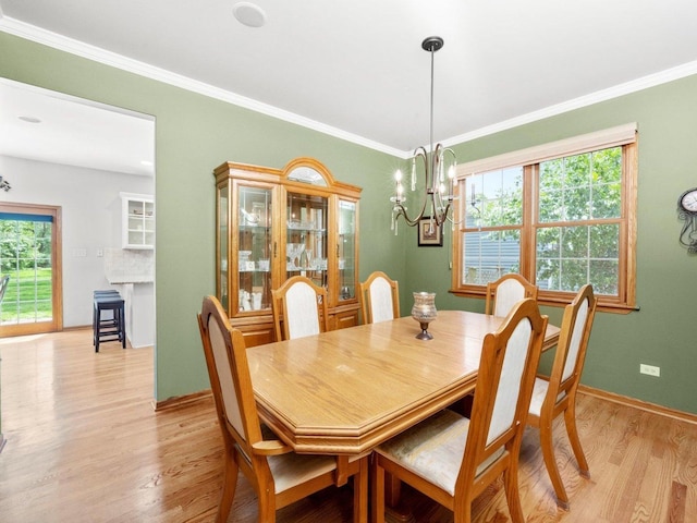 3445 W 114th St, Chicago, IL 60655 - dining room with a chandelier, light wood-style flooring, healthy amount of natural light, crown molding, and baseboards