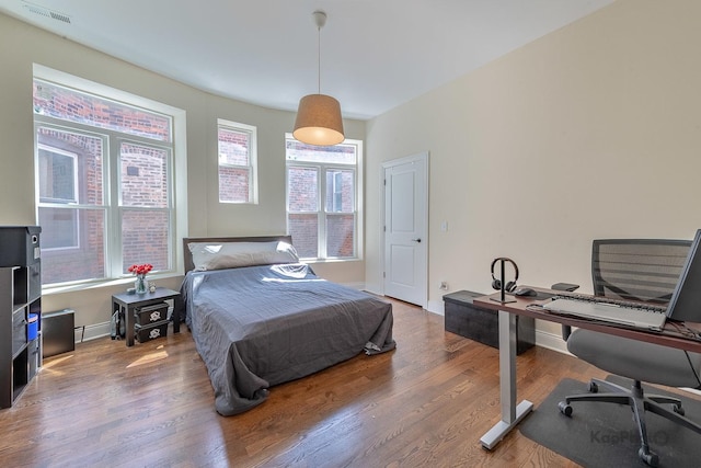 4520 S King Dr Unit 4B, Chicago, IL 60653 - bedroom with wood finished floors, a desk, and baseboards