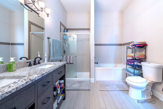 4520 S King Dr Unit 4B, Chicago, IL 60653 - bathroom with a bath, a stall shower, toilet, and double vanity