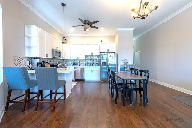 4520 S King Dr Unit 4B, Chicago, IL 60653 - kitchen featuring appliances with stainless steel finishes, open shelves, a peninsula, ceiling fan, and white cabinetry