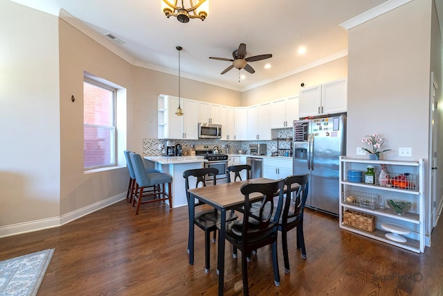 4520 S King Dr Unit 4B, Chicago, IL 60653 - dining space featuring a ceiling fan, crown molding, dark wood finished floors, baseboards, and recessed lighting