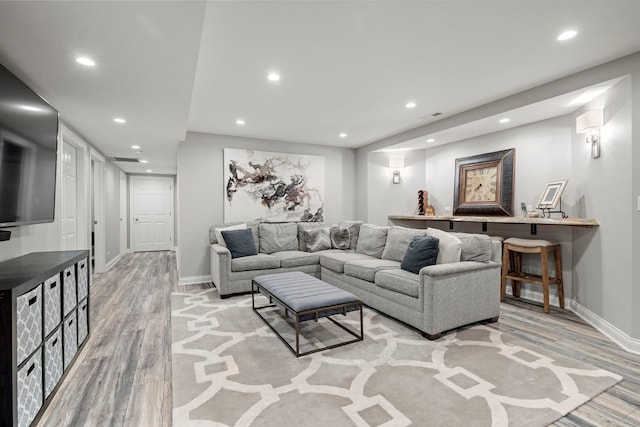 12433 Dublin Ln, Plainfield, IL 60585 - living area featuring light wood finished floors, recessed lighting, and baseboards