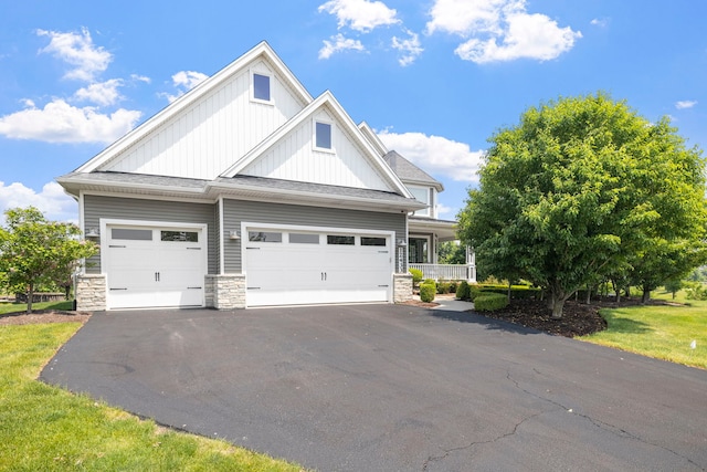12433 Dublin Ln, Plainfield, IL 60585 - craftsman inspired home featuring driveway, an attached garage, board and batten siding, and stone siding
