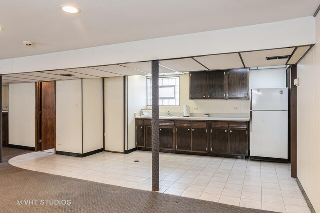 5341 S Austin Ave, Chicago, IL 60638 - basement with freestanding refrigerator, light tile patterned floors, and baseboards