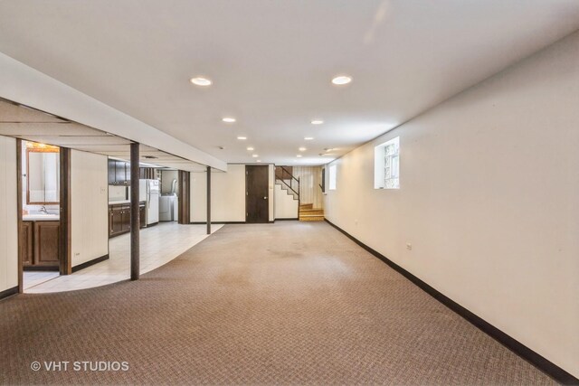 5341 S Austin Ave, Chicago, IL 60638 - below grade area with light colored carpet, stairs, baseboards, recessed lighting, and freestanding refrigerator