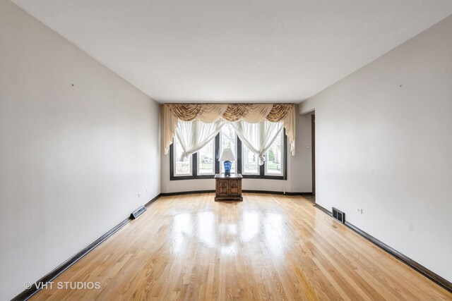5341 S Austin Ave, Chicago, IL 60638 - unfurnished room with light wood-style floors and baseboards