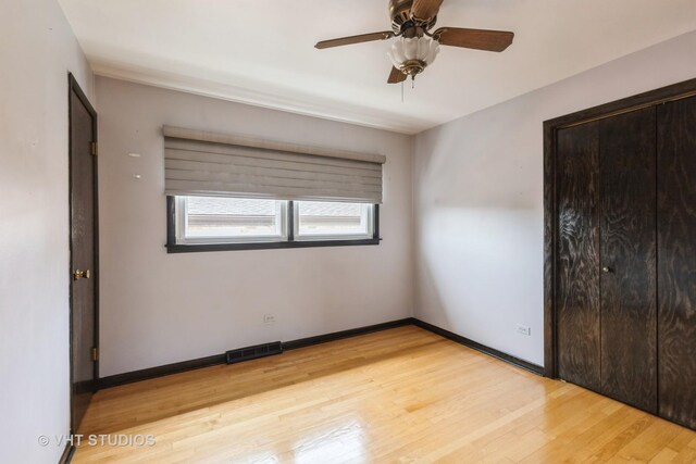 5341 S Austin Ave, Chicago, IL 60638 - unfurnished bedroom featuring light wood-style flooring, baseboards, and ceiling fan