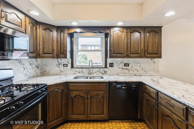 5341 S Austin Ave, Chicago, IL 60638 - kitchen with black appliances, a sink, backsplash, light stone counters, and dark brown cabinetry