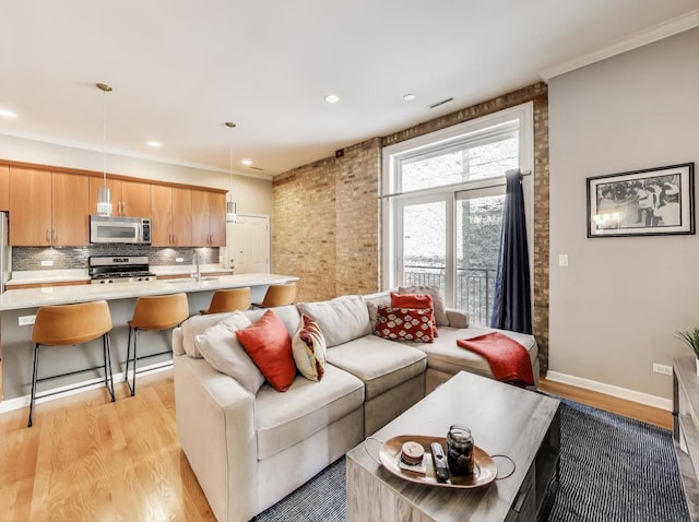 834 N Wood St Unit 2N, Chicago, IL 60622 - living area with light wood-style flooring, recessed lighting, baseboards, and crown molding