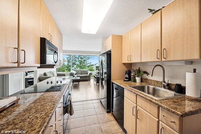 800 Elgin Rd Unit 806, Evanston, IL 60201 - kitchen with black appliances, light brown cabinetry, a textured ceiling, dark stone counters, and open floor plan