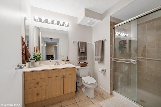 800 Elgin Rd Unit 806, Evanston, IL 60201 - bathroom featuring vanity, tile patterned floors, and a stall shower